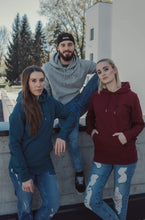 A unisex hoodie made from eco-friendly materials in shades of grey, burgundy and teal. The hoodie has a relaxed fit, long sleeves and a drawstring hood. The fabric used is soft and comfortable, giving the wearer a cozy feeling. The hoodie is suitable for both men and women and promotes sustainable and conscious consumption. The back shows a black print of waves, sun and palm tree.