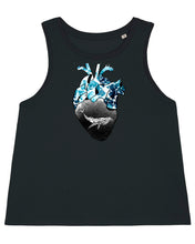 A women's black high-neck tank top featuring a geometric whale and a realistic wave heart design. The sleeveless top has a figure-hugging cut and reaches to the middle of the hips. The graphic design features a geometric whale and a realistic heart with waves, giving the product a unique and stylish touch. The fabric is soft and comfortable, giving the wearer a comfortable feeling. The product is suitable for environmentally conscious consumers and promotes sustainable fashion.